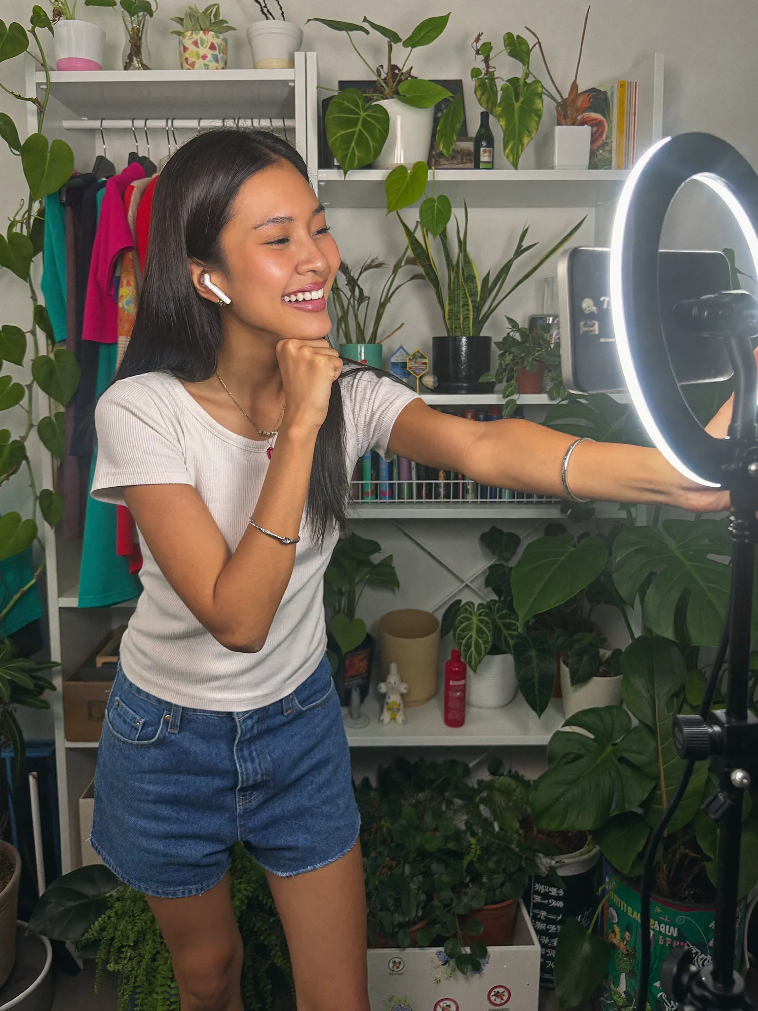 Jade filming a plant video with tropical foliage in Manila